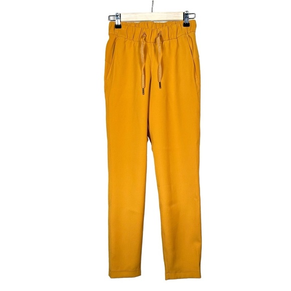 LULULEMON On the Fly 7/8 Woven Pant 27” in Fools Gold - Picture 6 of 13